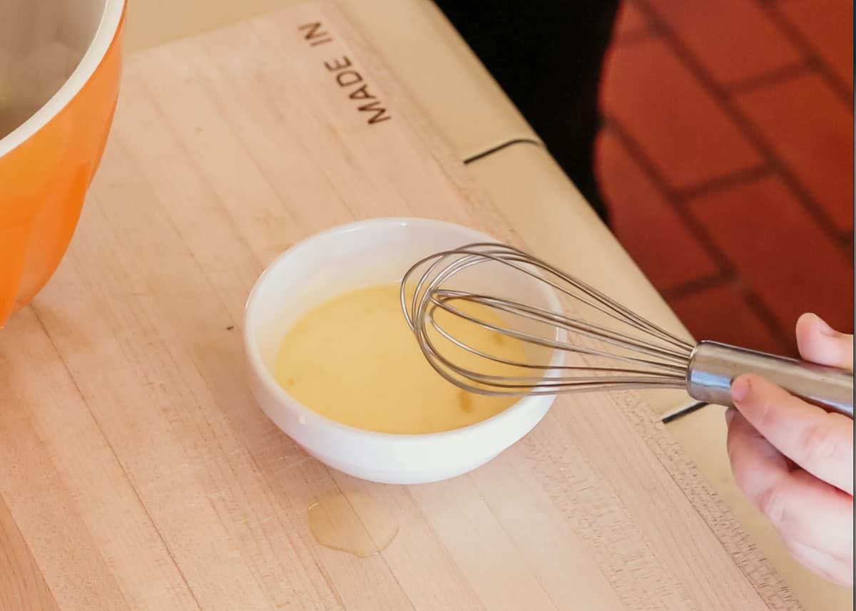 whisking egg and water for egg wash